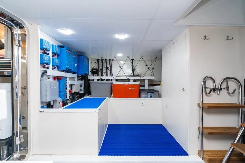 Slide: The Image of Engine room of 2013 Ocean Alexander 72 Pilothouse yacht with equipment and storage. - 60