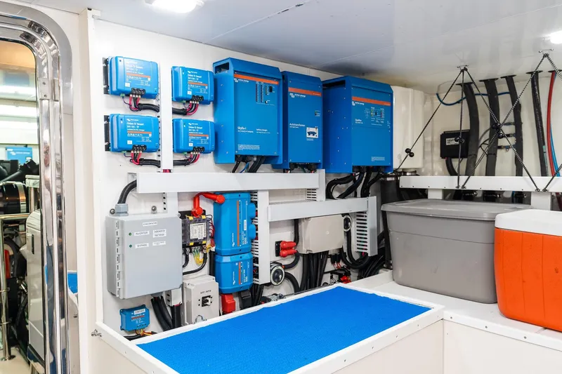 Slide: The Image of Electrical system in 2013 Ocean Alexander 72 Pilothouse yacht, featuring blue power inverters. - 61