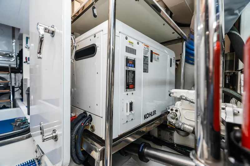 Slide: The Image of Engine room of 2013 Ocean Alexander 72 Pilothouse with Kohler generator. - 63