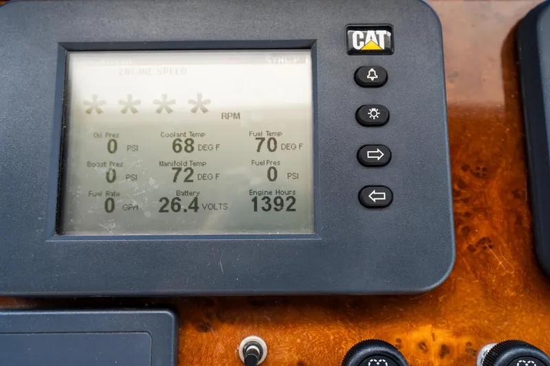 Slide: The Image of Instrument panel of 2013 Ocean Alexander 72 Pilothouse showing engine metrics and CAT logo. - 70