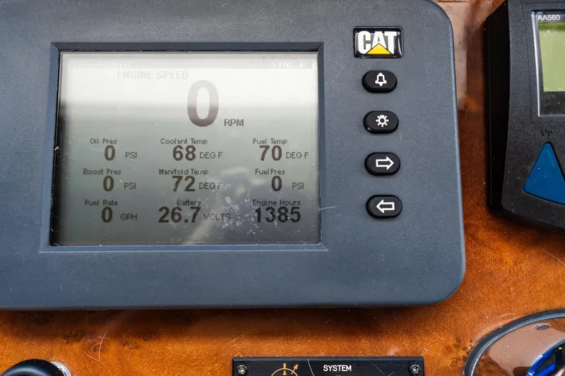 Slide: The Image of Control panel of a 2013 Ocean Alexander 72 Pilothouse displaying engine metrics. - 71