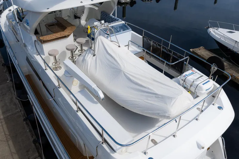 Slide: The Image of 2013 Ocean Alexander 72 Pilothouse yacht with covered deck and seating area. - 8