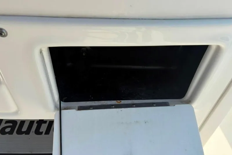 Slide: The Image of Storage compartment on a 2016 NauticStar 2102 Legacy boat. - 10