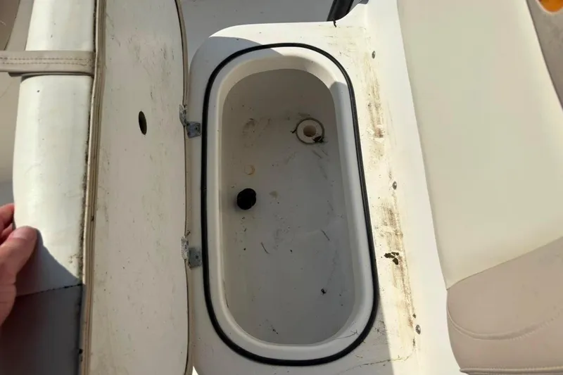 Slide: The Image of Open storage compartment on a 2016 NauticStar 2102 Legacy boat. - 13