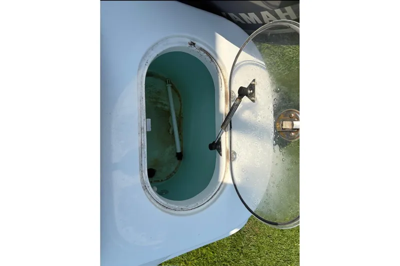 Slide: The Image of Open hatch of 2016 NauticStar 2102 Legacy boat, showing interior compartment. - 4