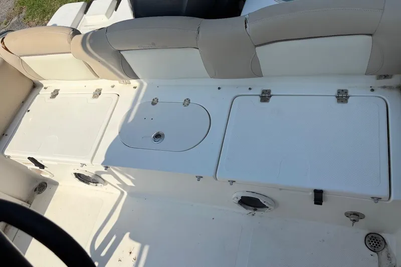 Slide: The Image of 2016 NauticStar 2102 Legacy boat interior with storage compartments and seating. - 5