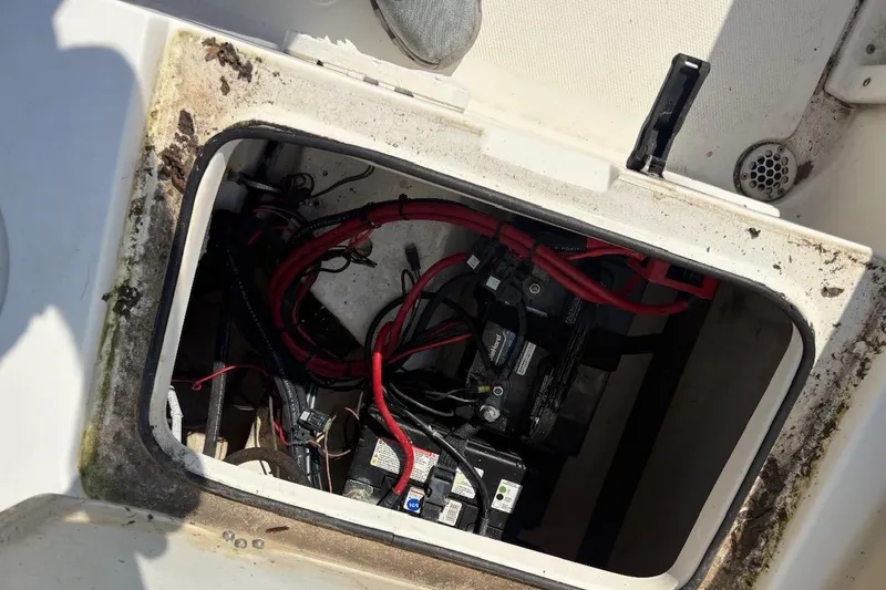 Slide: The Image of Battery compartment of 2016 NauticStar 2102 Legacy boat with visible wiring. - 6