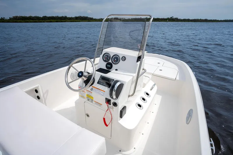Slide: The Image of Manufacturer Provided Image: 2025 Bayliner Trophy T18 boat interior with steering console on open water. - 10