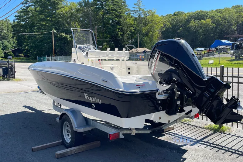 Slide: The Image of 2025 Bayliner Trophy T18 boat on trailer, featuring Mercury outboard motor. - 2