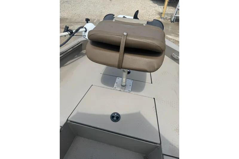 Slide: The Image of 2020 Excel 203 Bay Pro boat seat and deck, featuring a brown cushioned seat. - 13