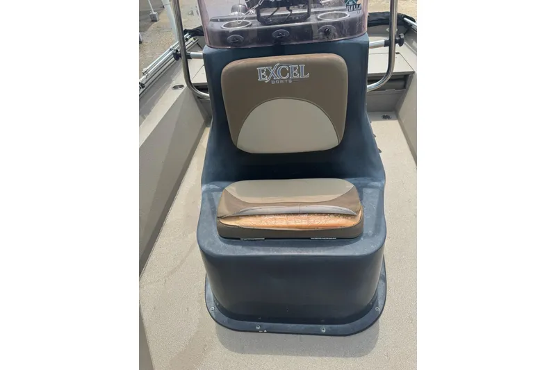 Slide: The Image of 2020 Excel 203 Bay Pro boat seat with logo, featuring tan and brown upholstery. - 14