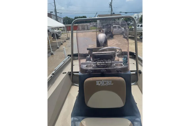 Slide: The Image of 2020 Excel 203 Bay Pro boat interior with steering console and windshield. - 16