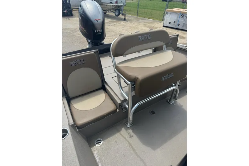 Slide: The Image of 2020 Excel 203 Bay Pro boat interior with seating and Yamaha 115 engine. - 23
