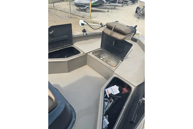 Slide: The Image of 2020 Excel 203 Bay Pro boat interior with open storage compartments. - 24