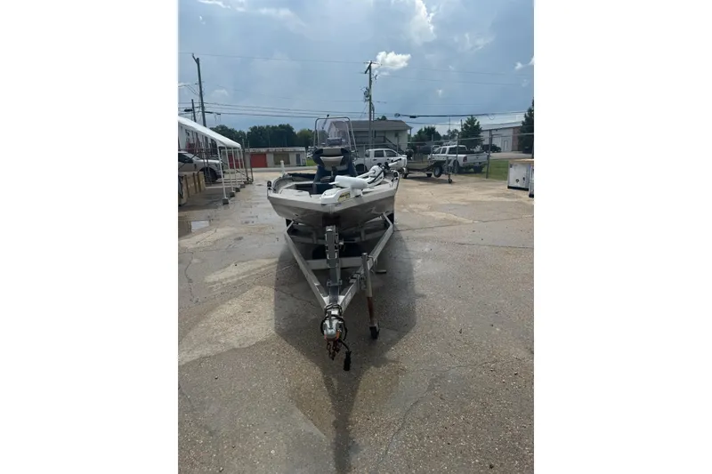 Slide: The Image of 2020 Excel 203 Bay Pro boat on trailer in outdoor lot. - 9