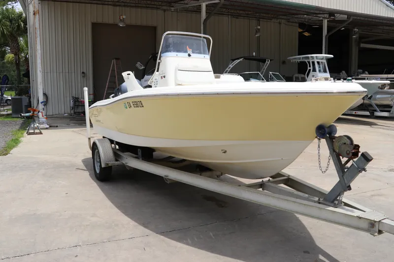 Slide: The Image of 2004 Pioneer 175 Bay Sport boat on trailer outside a storage facility. - 2