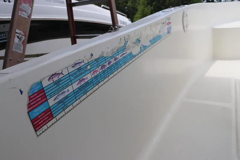 Slide: The Image of 2004 Pioneer 175 Bay Sport boat interior with fish measurement chart. - 23