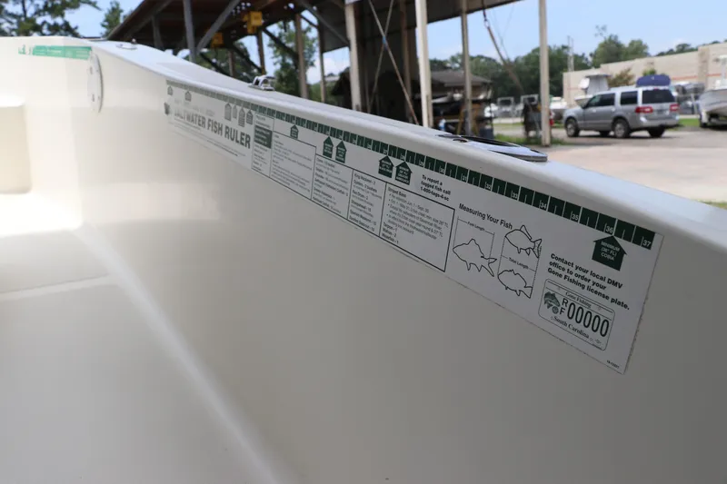 Slide: The Image of 2004 Pioneer 175 Bay Sport boat interior with fish ruler and measurement guide. - 24