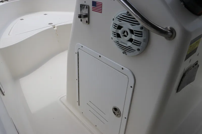Slide: The Image of 2004 Pioneer 175 Bay Sport boat interior with speaker and storage compartment. - 26