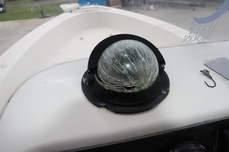 Slide: The Image of Cracked compass on 2004 Pioneer 175 Bay Sport boat dashboard. - 29