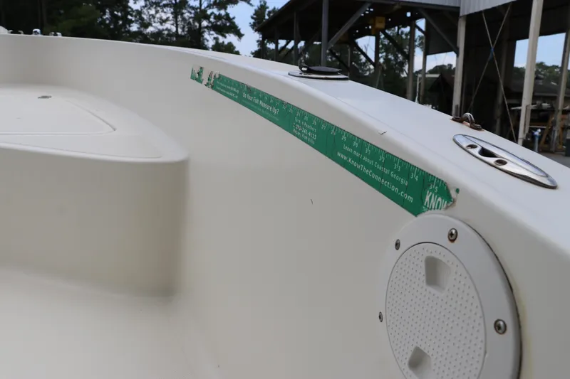 Slide: The Image of 2004 Pioneer 175 Bay Sport boat interior with ruler sticker and speaker detail. - 33