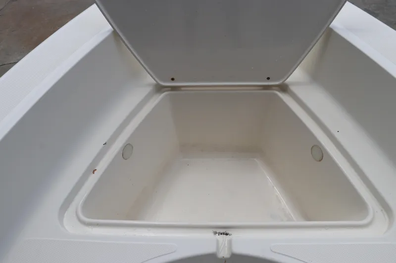 Slide: The Image of Open storage compartment on 2004 Pioneer 175 Bay Sport boat. - 36