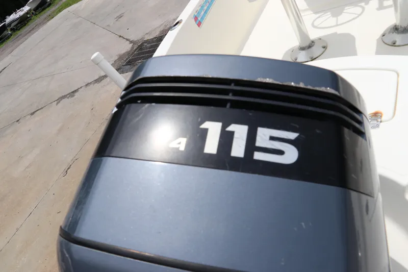 Slide: The Image of Outboard motor on 2004 Pioneer 175 Bay Sport boat, displaying "115" horsepower. - 6