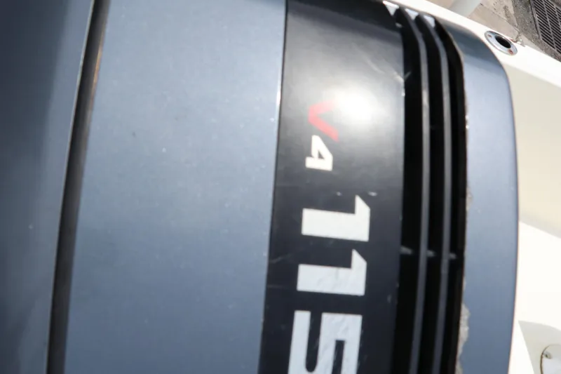 Slide: The Image of Outboard motor with V4 115 label on a 2004 Pioneer 175 Bay Sport boat. - 7