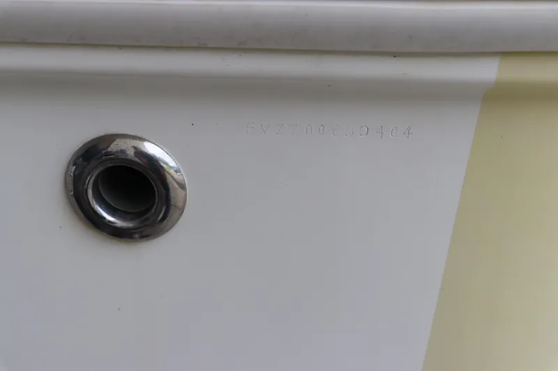 Slide: The Image of Close-up of a 2004 Pioneer 175 Bay Sport boat hull identification number. - 8