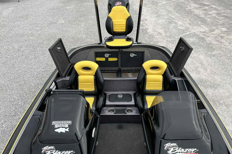 Slide: The Image of 2017 Blazer 625 Pro Elite boat interior with yellow and black seats, open storage compartments. - 13