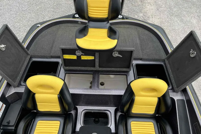 Slide: The Image of 2017 Blazer 625 Pro Elite boat interior with yellow seats and open storage compartments. - 14