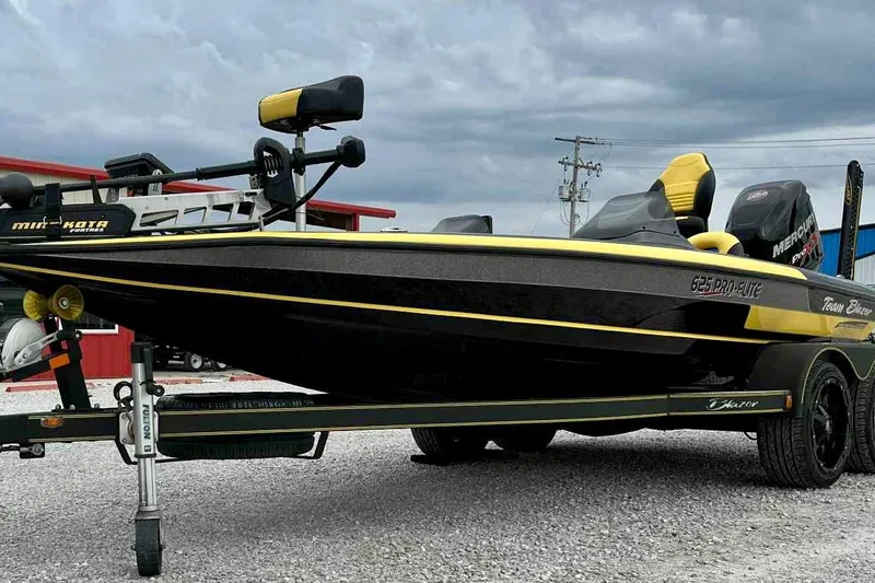 Slide: The Image of 2017 Blazer 625 Pro Elite boat with yellow and black design on a trailer. - 18