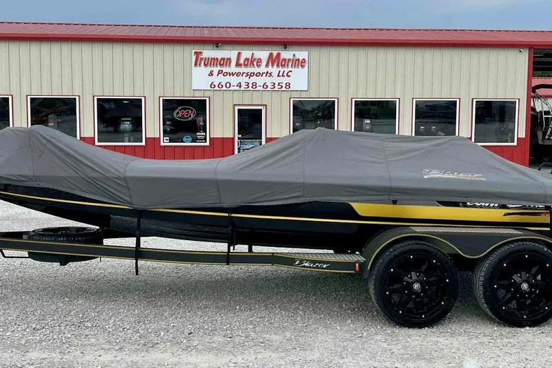 Slide: The Image of 2017 Blazer 625 Pro Elite boat covered, parked at Truman Lake Marine. - 19