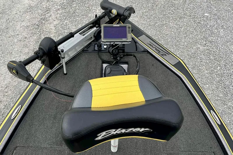 Slide: The Image of 2017 Blazer 625 Pro Elite boat interior with seat, control panel, and navigation system. - 4