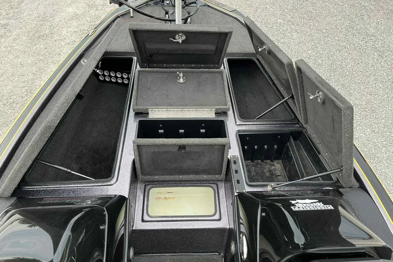 Slide: The Image of 2017 Blazer 625 Pro Elite boat with open storage compartments and sleek design. - 8