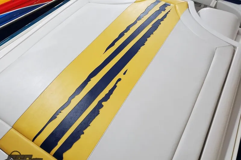 Slide: The Image of Yellow and blue striped upholstery on 2001 Hustler 50 Monster boat. - 15