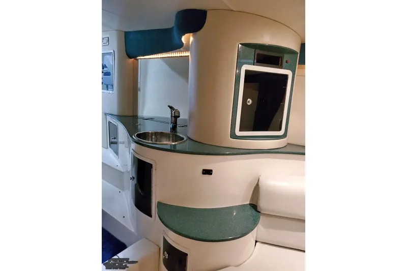 Slide: The Image of 2001 Hustler 50 Monster boat interior with sink and storage cabinets. - 32