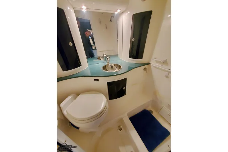 Slide: The Image of 2001 Hustler 50 Monster boat bathroom with sink, toilet, and shower area. - 33