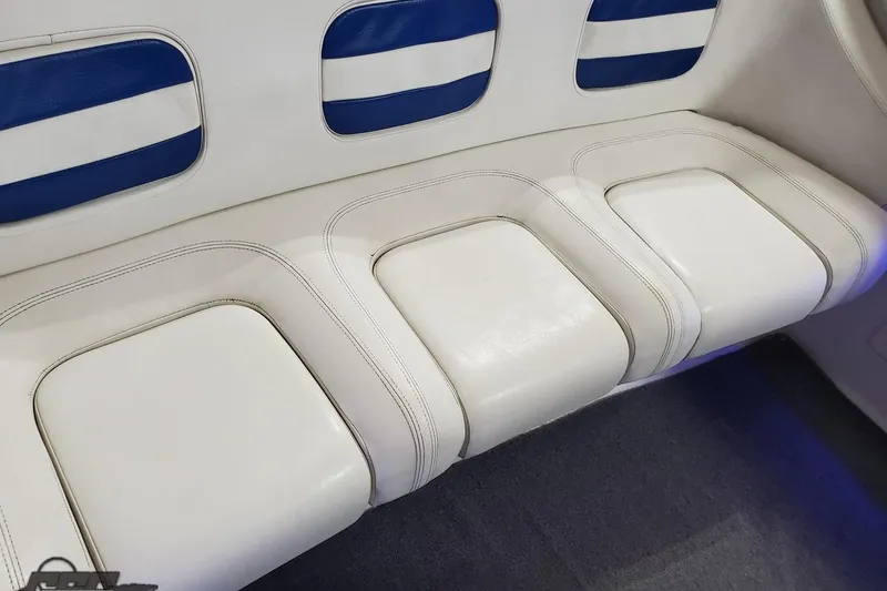 Slide: The Image of White and blue leather seating in 2001 Hustler 50 Monster boat interior. - 35