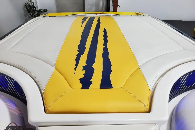 Slide: The Image of Yellow and white Hustler 50 Monster boat with blue stripe design, 2001 model. - 36