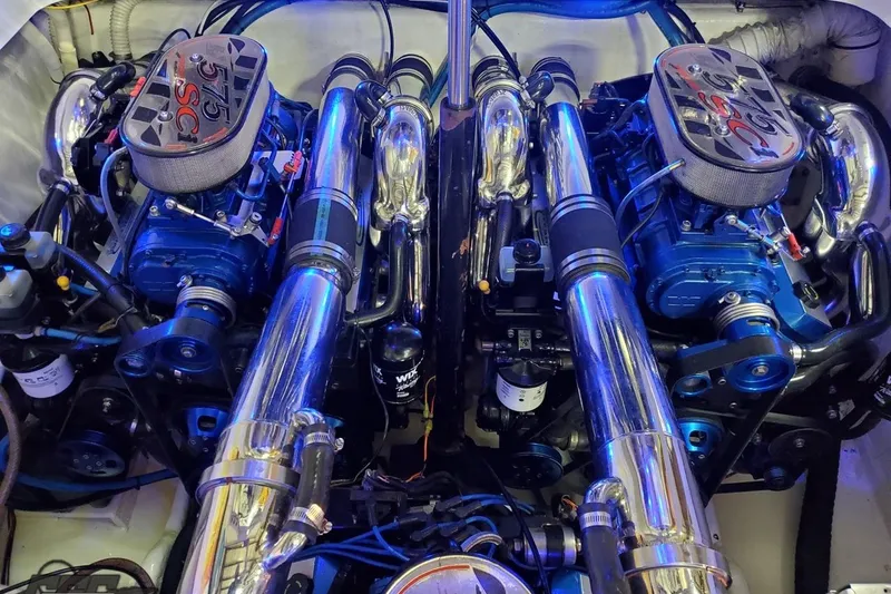 Slide: The Image of Engine compartment of a 2001 Hustler 50 Monster with dual high-performance engines. - 39