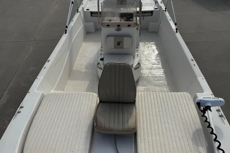 Slide: The Image of 2016 Carolina Skiff 218 DLV boat interior with seating and console, viewed from above. - 6