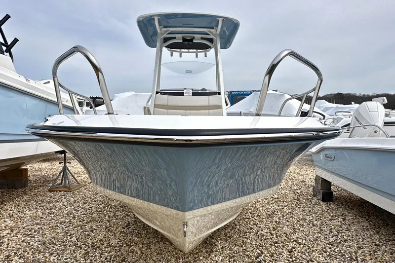 Slide: The Image of 2026 Boston Whaler 220 Dauntless boat on gravel, front view. - 15