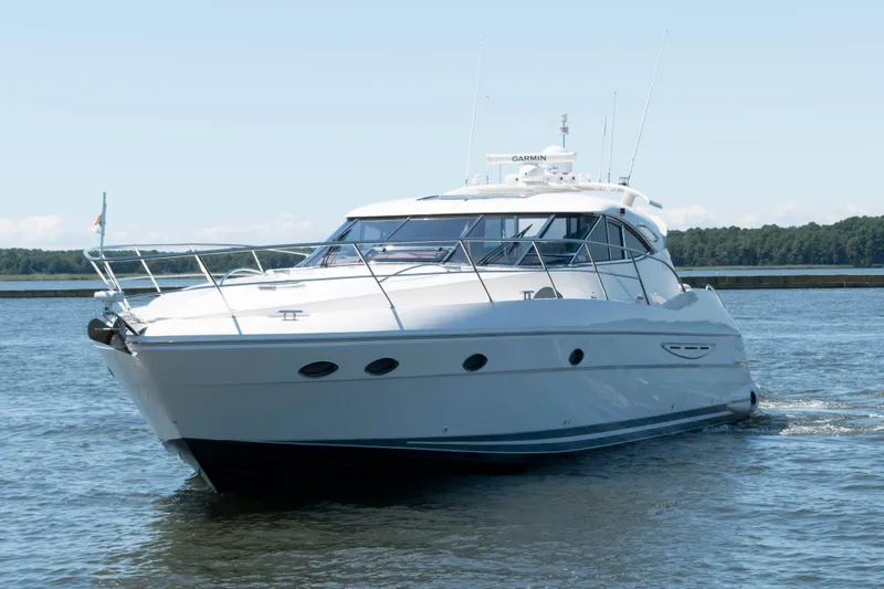 The Image of 2001 Neptunus 56 Express yacht cruising on calm waters. - 0