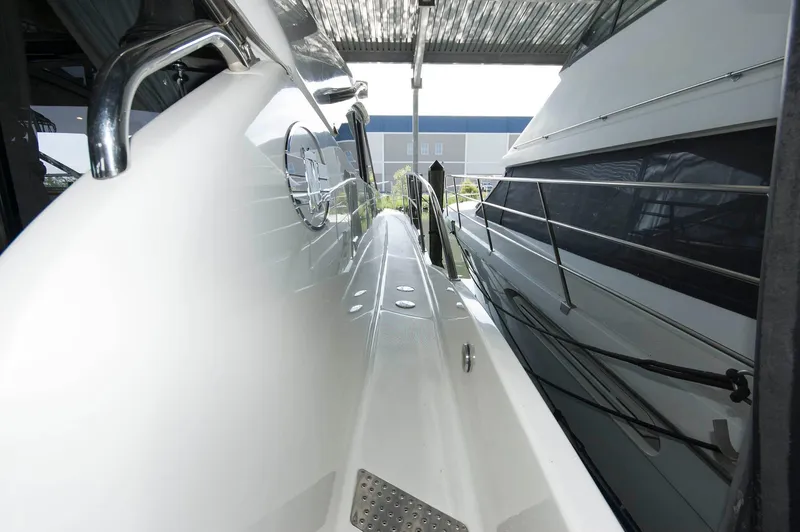 Slide: The Image of 2001 Neptunus 56 Express yacht side deck view under shelter. - 14
