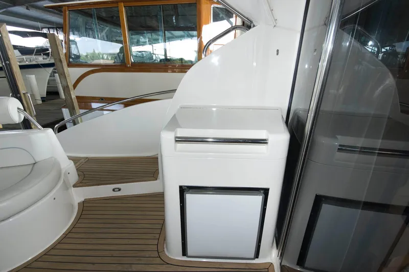 Slide: The Image of 2001 Neptunus 56 Express yacht interior with wooden flooring and modern amenities. - 16