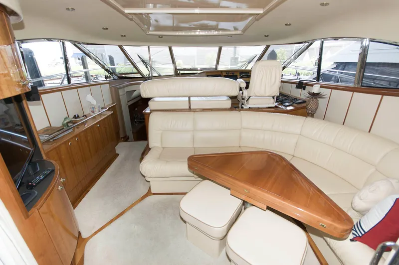 Slide: The Image of Luxurious interior of 2001 Neptunus 56 Express yacht with leather seating and wooden accents. - 17