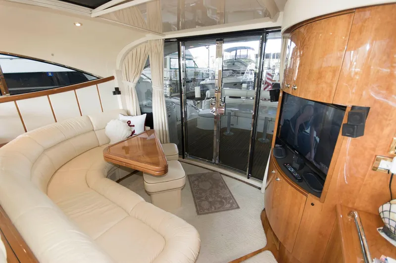 Slide: The Image of Luxurious interior of 2001 Neptunus 56 Express yacht with plush seating and entertainment area. - 20