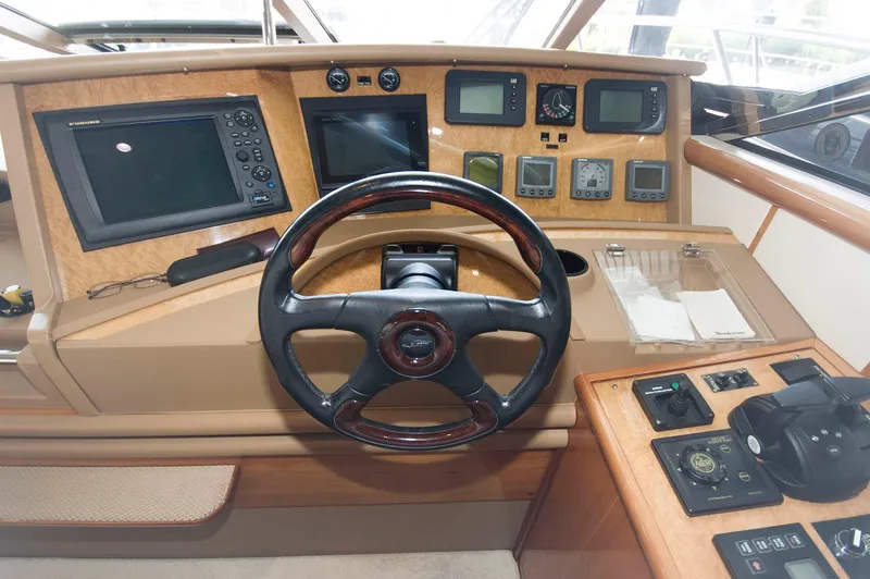 Slide: The Image of Helm of 2001 Neptunus 56 Express yacht with navigation instruments and steering wheel. - 22