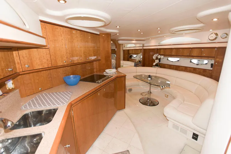 Slide: The Image of Luxurious interior of 2001 Neptunus 56 Express yacht with modern kitchen and seating area. - 26